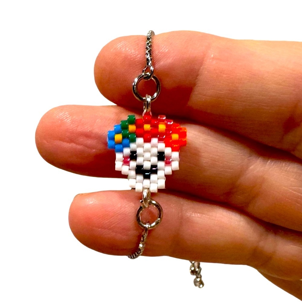 Handcrafted beaded Dia de Los Muertos slider bracelet with tiny colorful skull